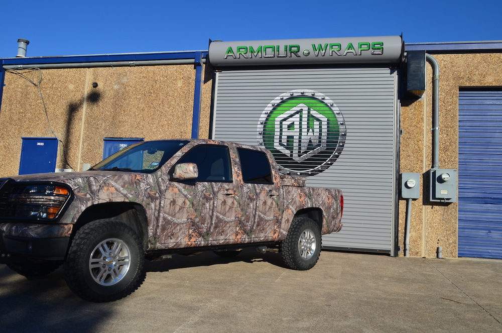 camouflage wrapped Chevy quad cab